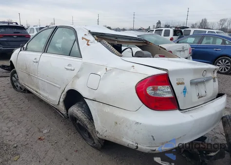 2003 Toyota Camry Le z USA, uszkodzony, nr VIN JTDBE32K930195126